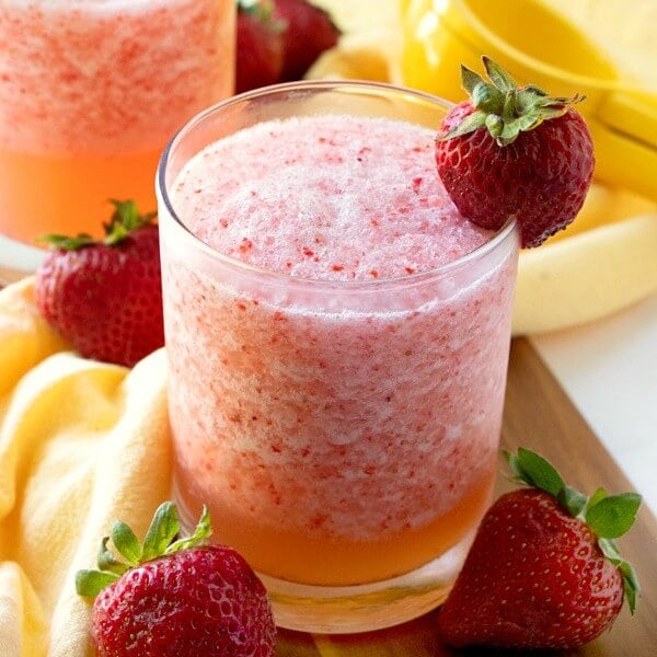fruit slush recipe with strawberry garnish