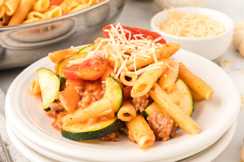 pork zucchini pasta ragu on plate