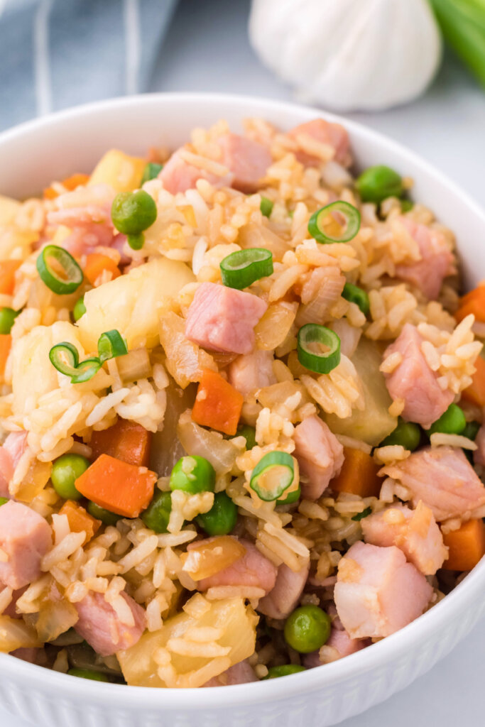 closeup of ham and pineapple fried rice in bowl