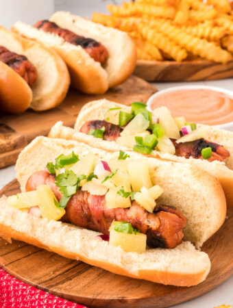 hawaiian hot dogs on wooden board