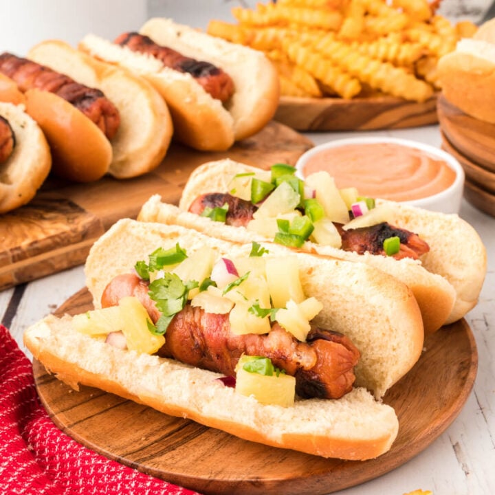hawaiian hot dogs on wooden board