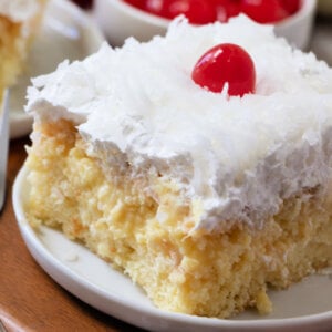 slice of pina colada poke cake