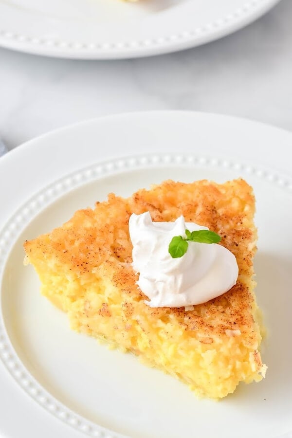 impossibly easy coconut pie on white plate