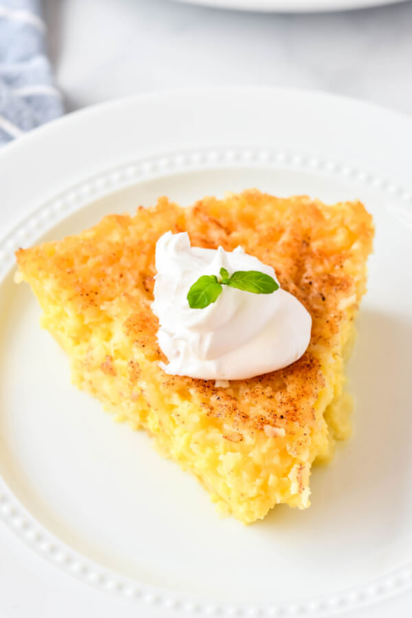 looking down onto a slice of pie on white plate