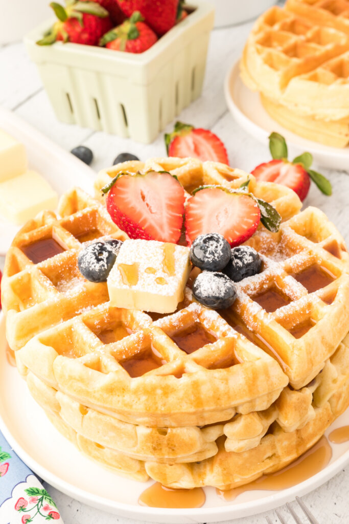 cllassic waffles with fruit butter and syrup on plate