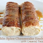 Pumpkin Spice Cheesecake Enchiladas with Caramel Drizzle on white plate.