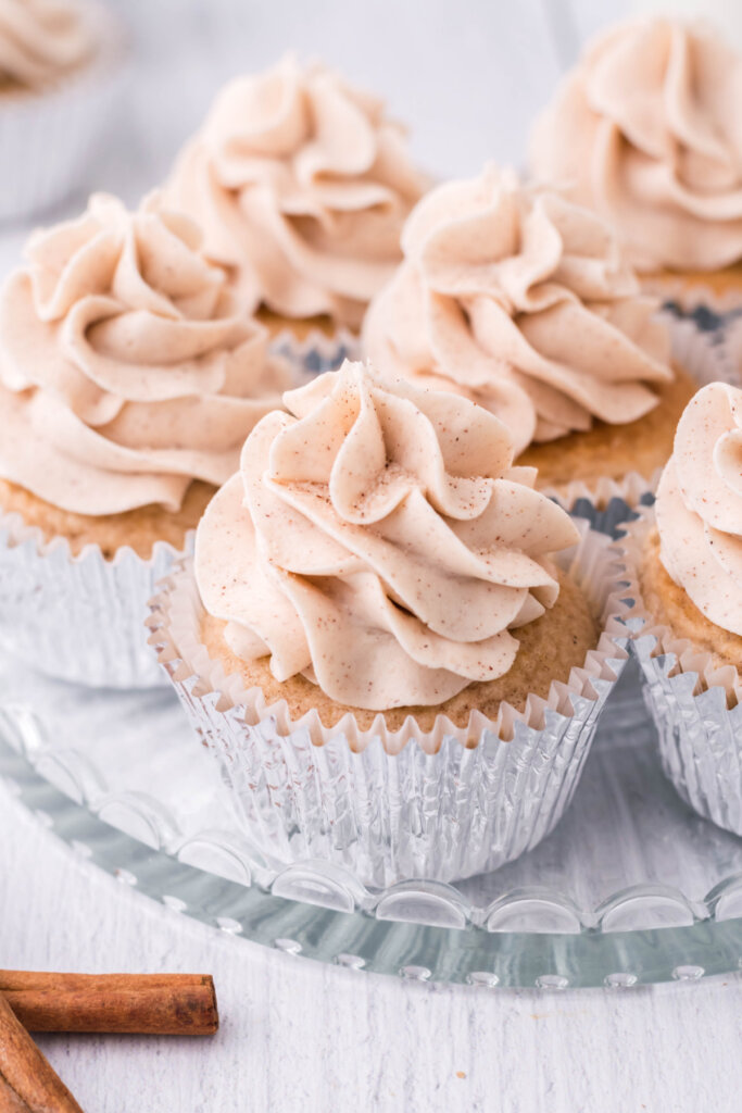 snickerdoodle cupcakes on glass serving plate