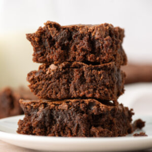 three brownies stacked on a plate