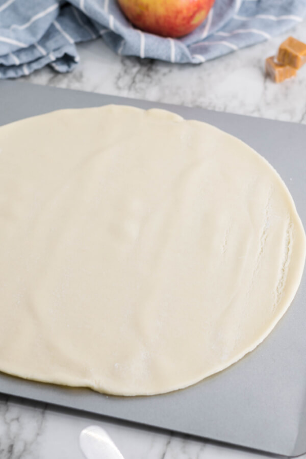 pie crust laid flat on baking sheet