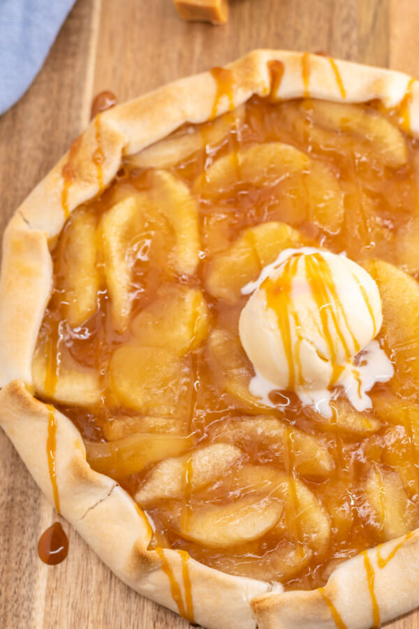 loooking down onto finihsed caramel apple galette with a scoop of ice cream