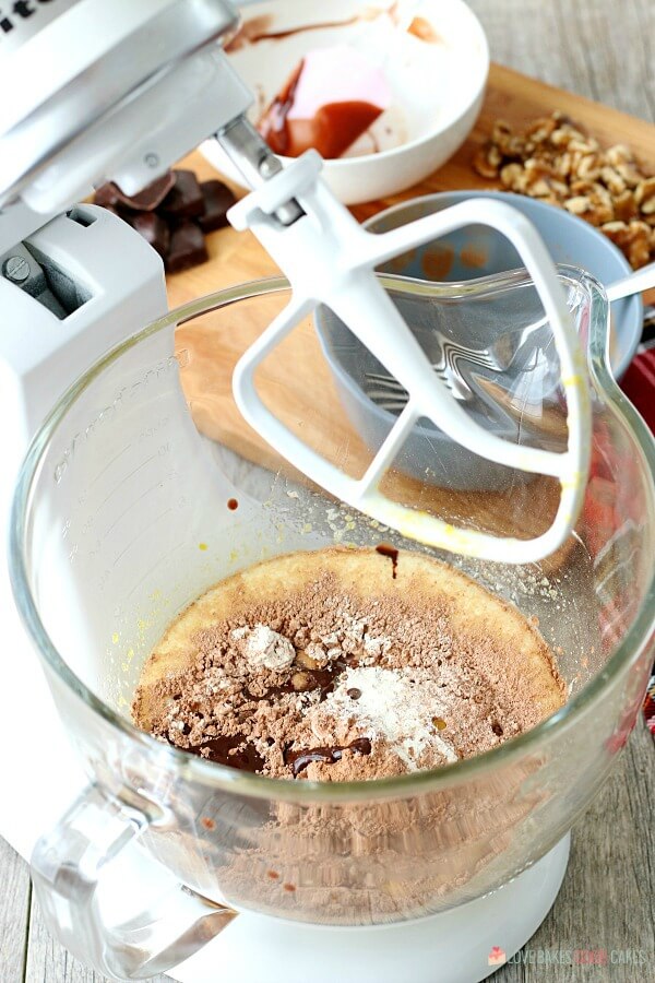 Christmas Chocolate Drop Cookie ingredients in a mixing bowl getting ready to be blended.