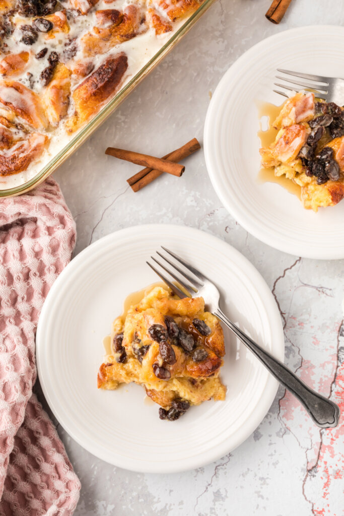 cinnamon roll bread pudding on plates