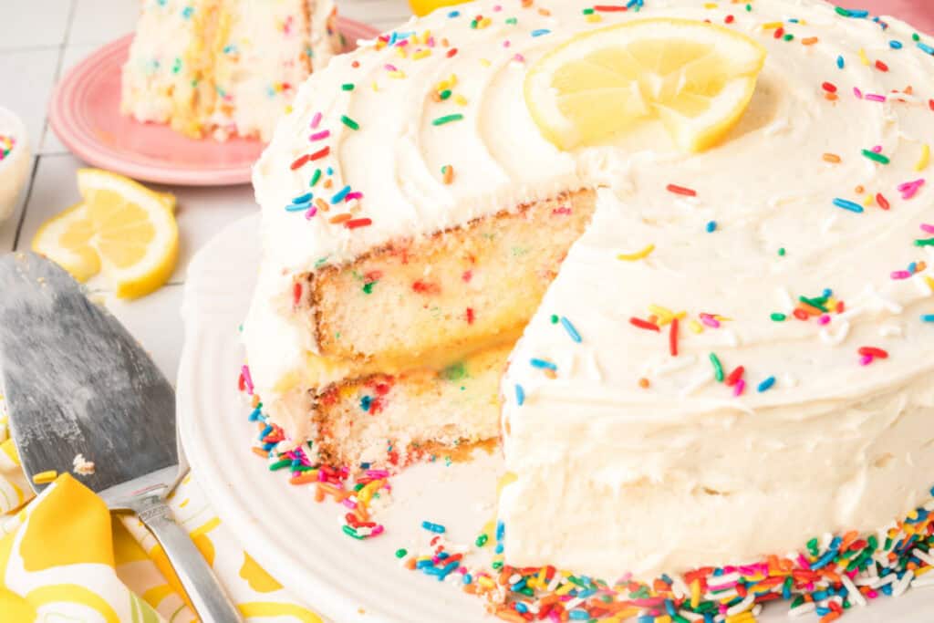 lemon funfetti cake with slice cut out