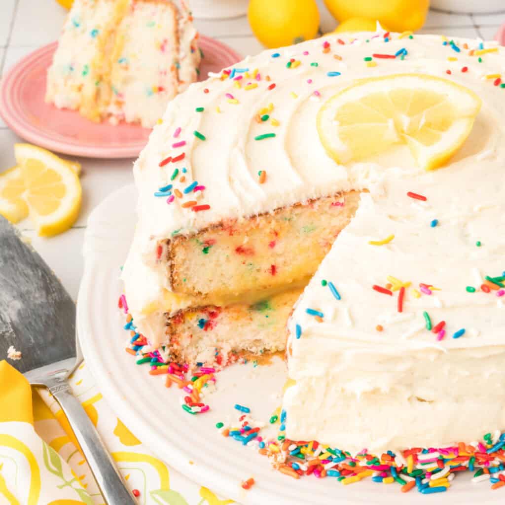 closeup of lemon funfetti cake with slice cut out