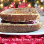 Berry Stuffed French Toast on white plate with fork.