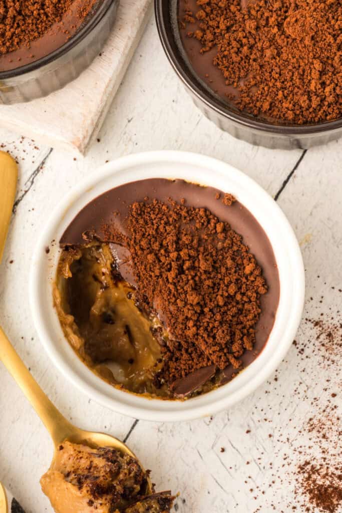 Cappuccino Crème Brûlée with a spoonful removed showing the creamy coffee custard filling