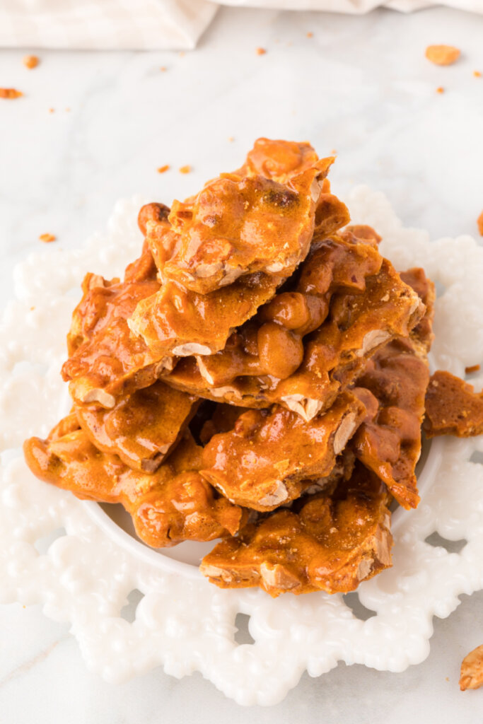 looking down on peanut brittle stacked on plate