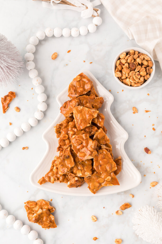 peanut brittle in a holiday plate and setting