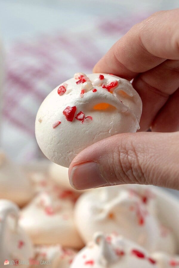 Someone holding a Peppermint Meringue.