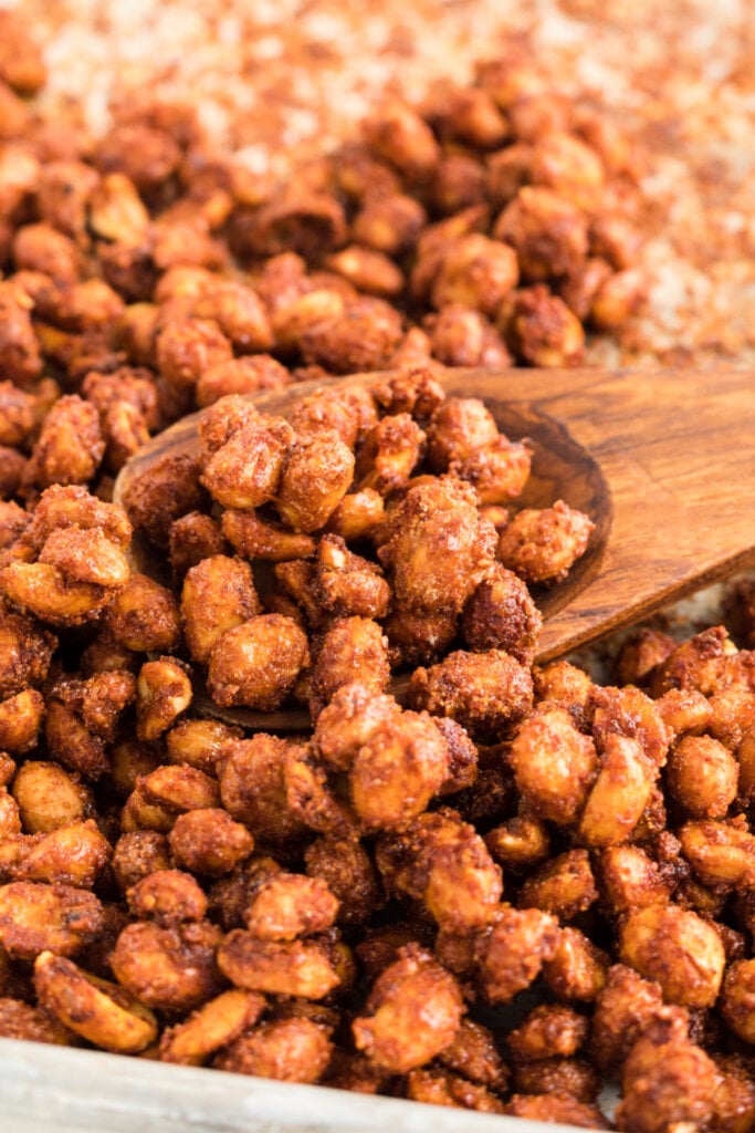 barbecue peanut on wooden spoon on a baking sheet