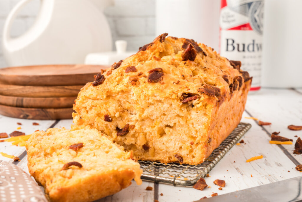 bacon cheddar beer bread with a slice cut off