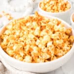 Buffalo Ranch Popcorn in a large white bowl with spicy buffalo seasoning for game-day snacks and movie nights