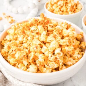 Buffalo Ranch Popcorn in a large white bowl with spicy buffalo seasoning for game-day snacks and movie nights