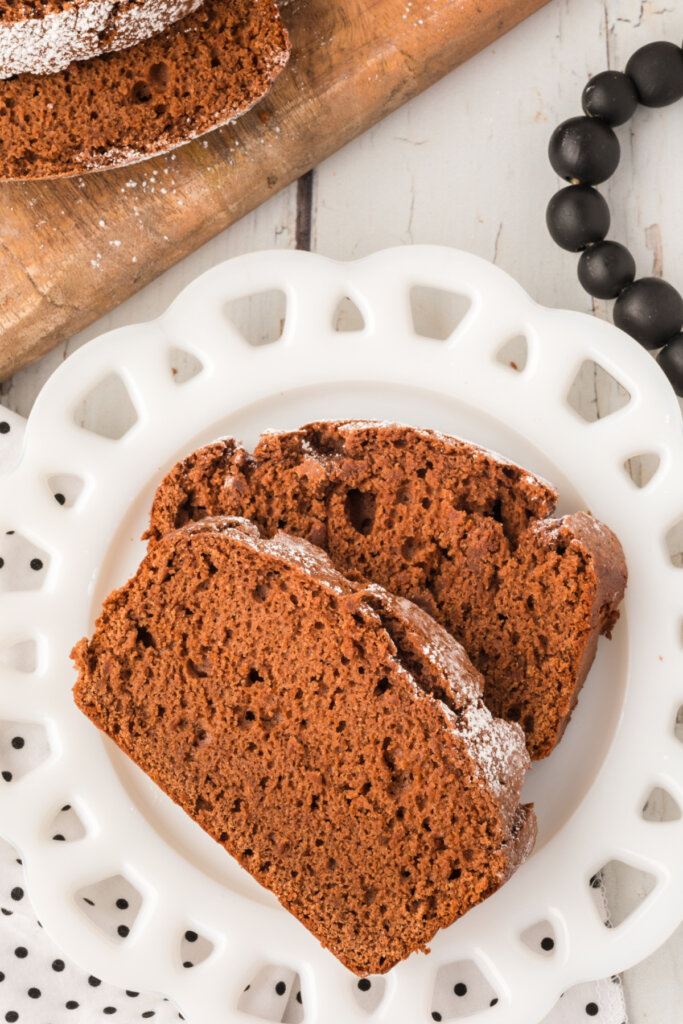 two slices of chocolate pound cake on a white plate