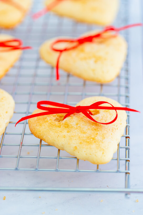 Heart cookies on a cooling rack.