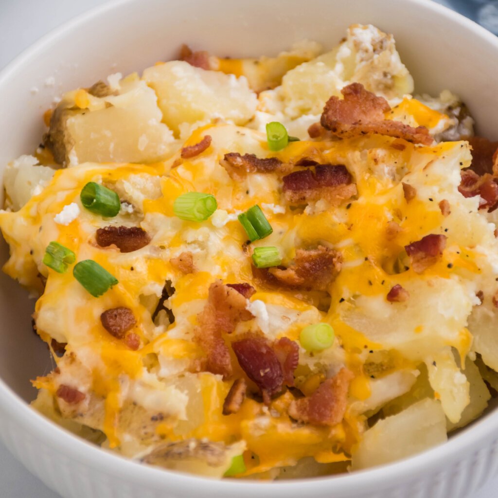 closeup of twice baked potato casserole in a white bowl