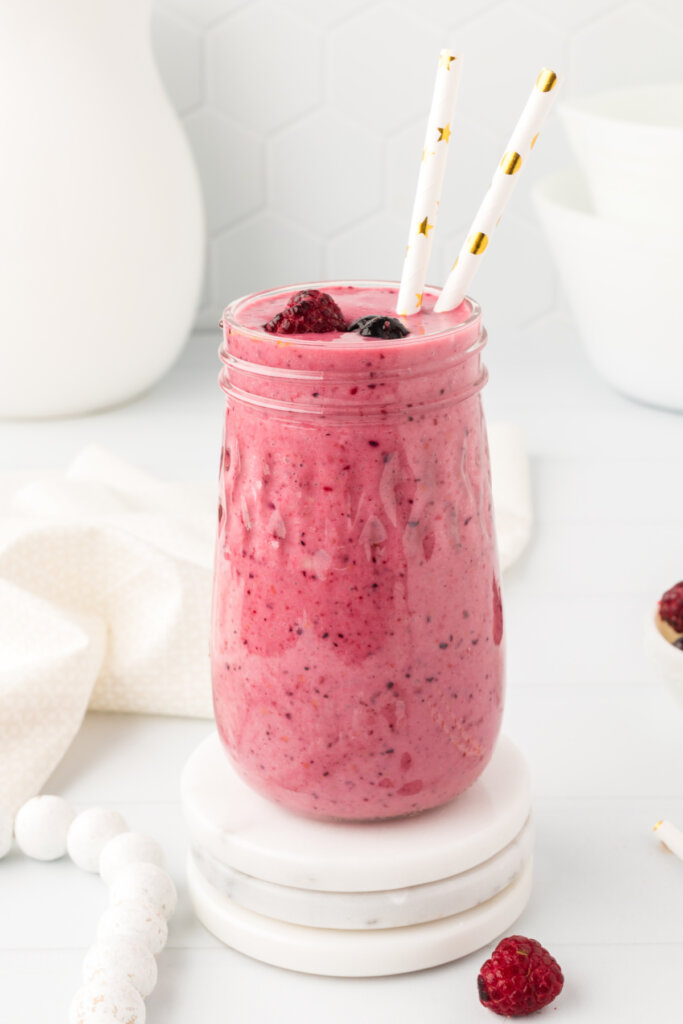 glass filled with banana berry smoothie