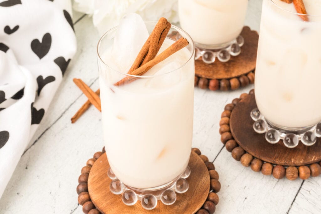 glass of horchata on wooden coaster