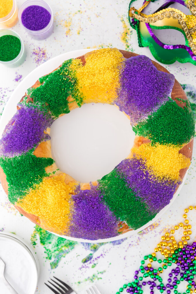looking down onto a colorful and festive new orleans king cake