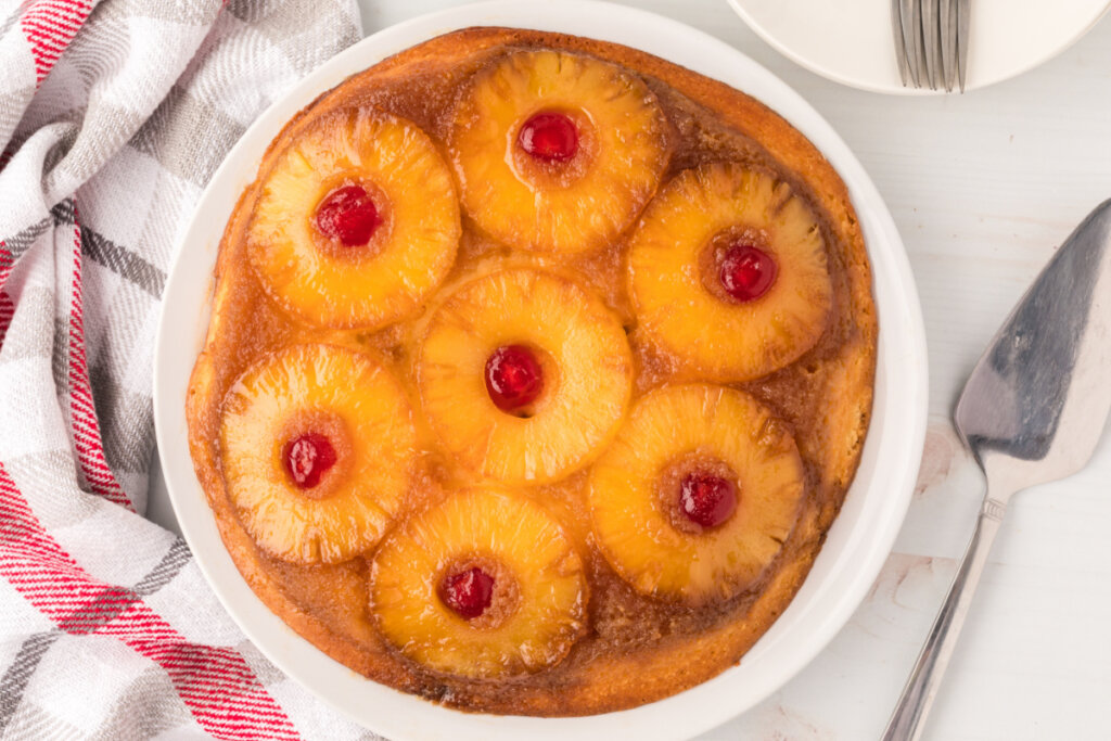 whole pineapple upside down cake on serving plate