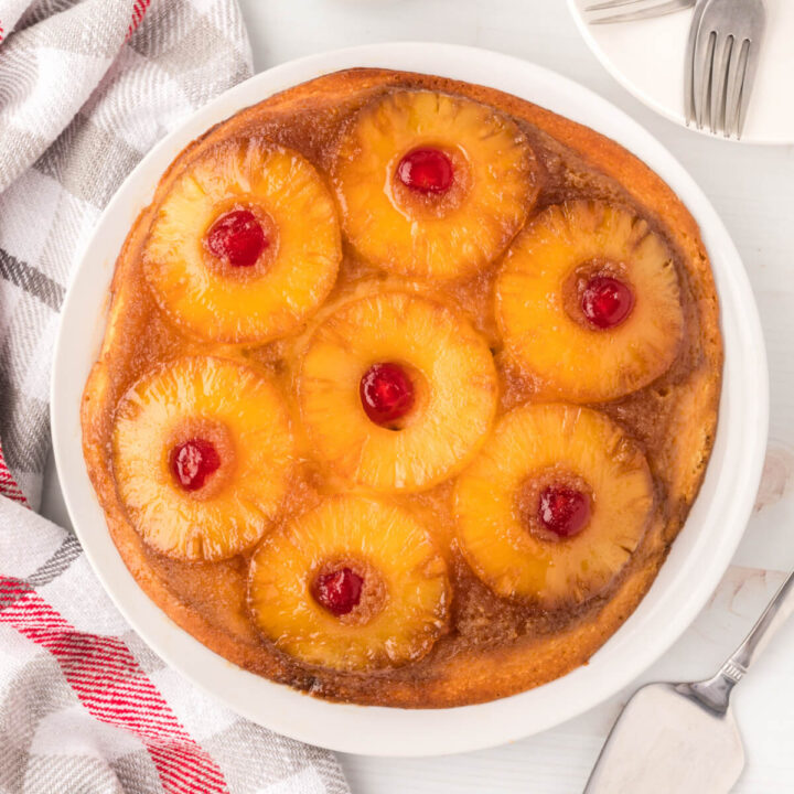 whole pineapple upside-down cake on serving plate