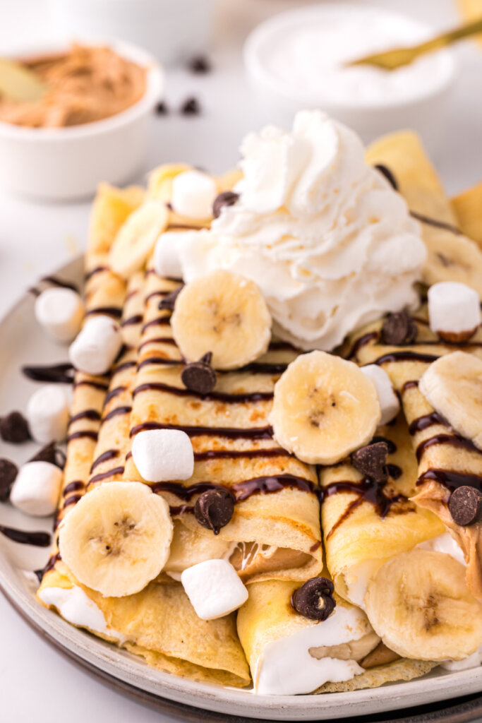 closeup of banana fluffernutter crepes on plate