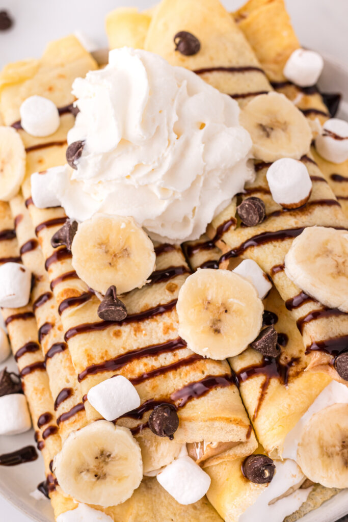 closeup of the toppings on banana fluffernutter crepes