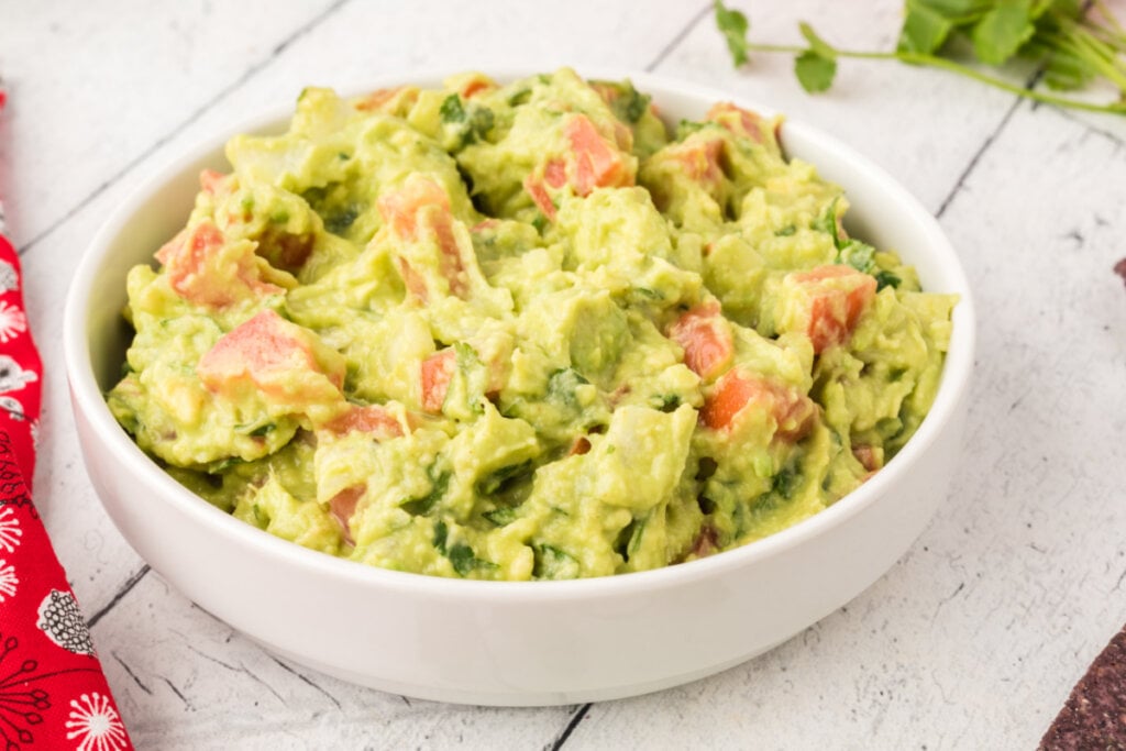 white bowl filled with guacamole