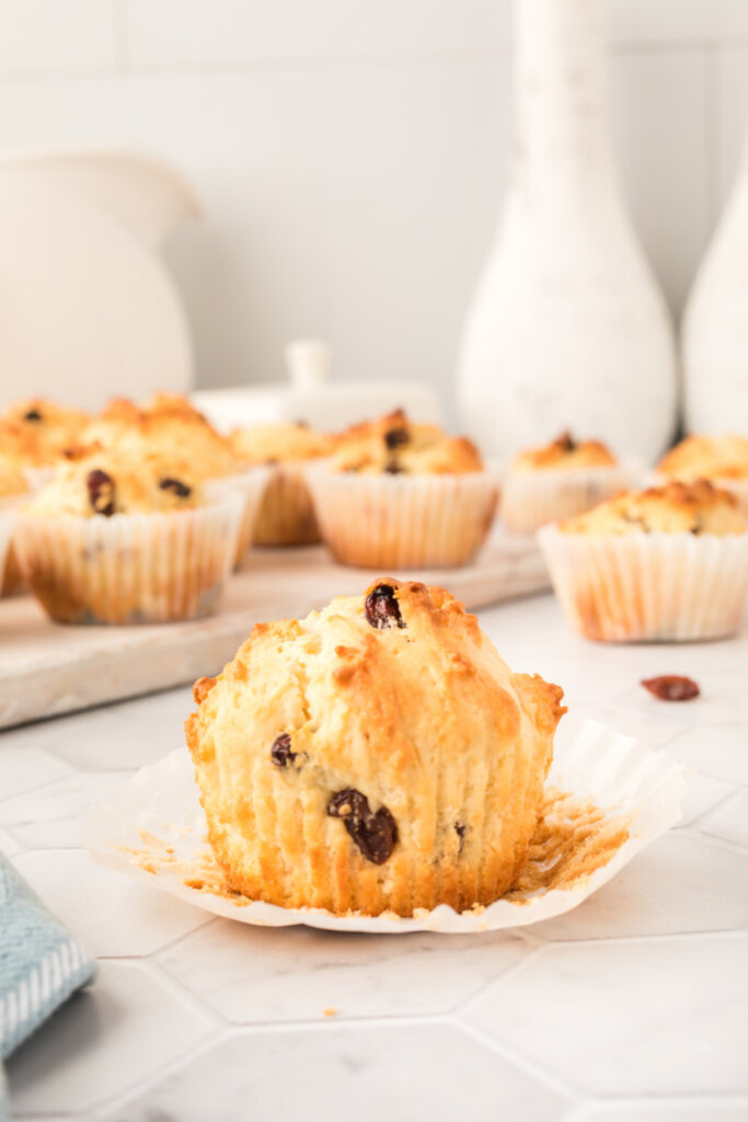 irish soda muffins with the paper wrapper pulled down off the muffin