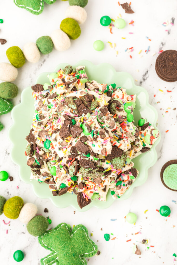 looking down onto a mint green plate filled with loaded leprechaun mint bark