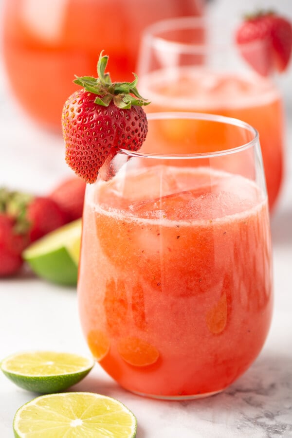 strawberry lime agua fresca in glass with strawberry garnish