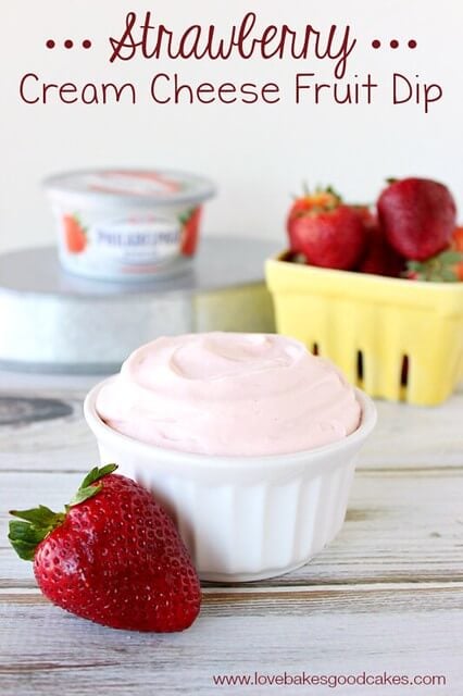 This Strawberry Cream Cheese Fruit Dip is made with Philadelphia Strawberry Cream Cheese in a white bowl with fresh strawberries.