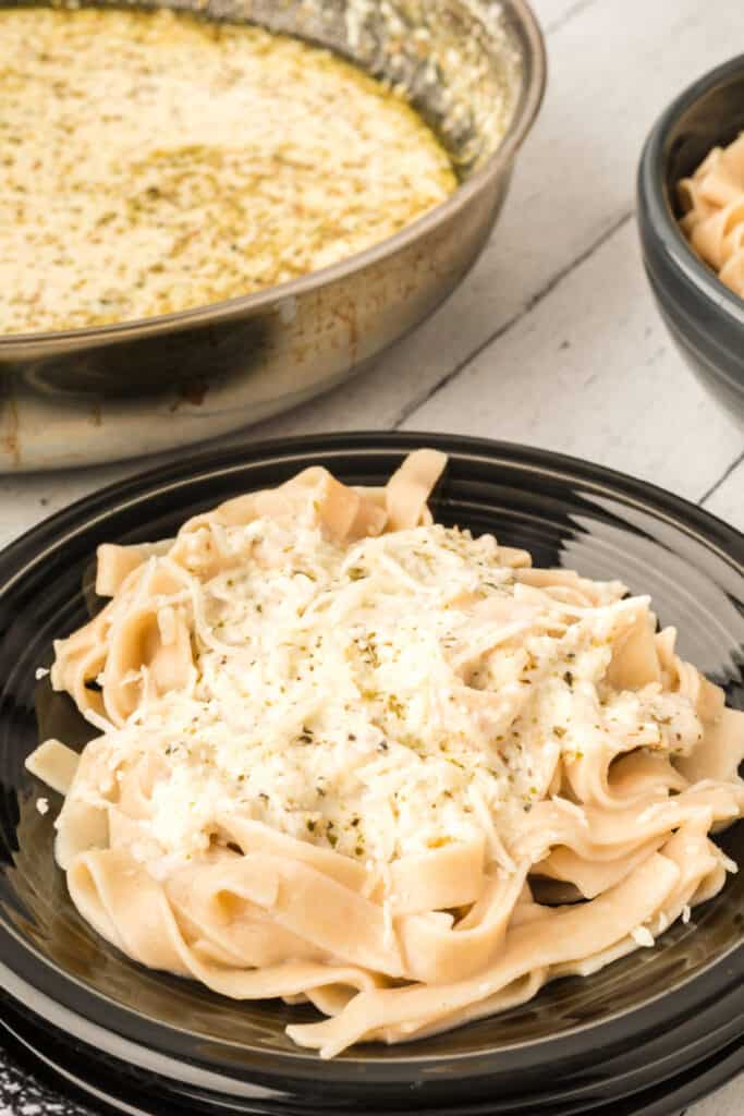 closeup of healthy alfredo sauce over the topof pasta