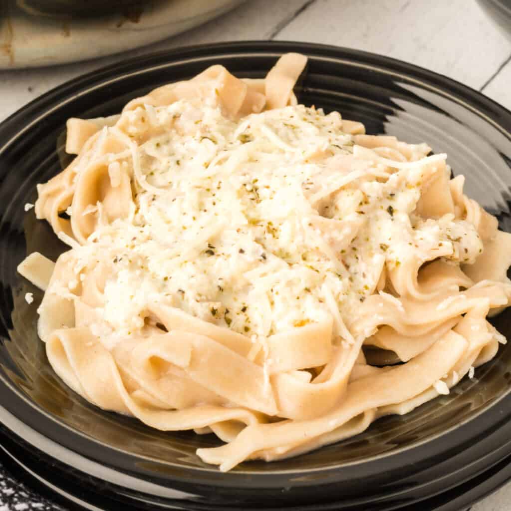 closeup bowl of pasta eith better for you alfredo sauce