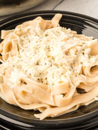closeup bowl of pasta eith better for you alfredo sauce