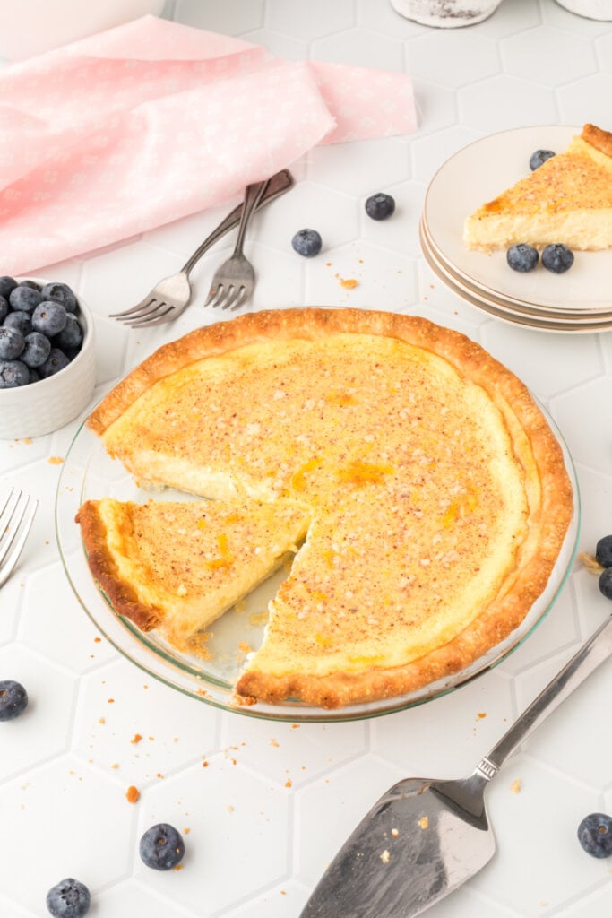custard pie with a slice cut out of the pie