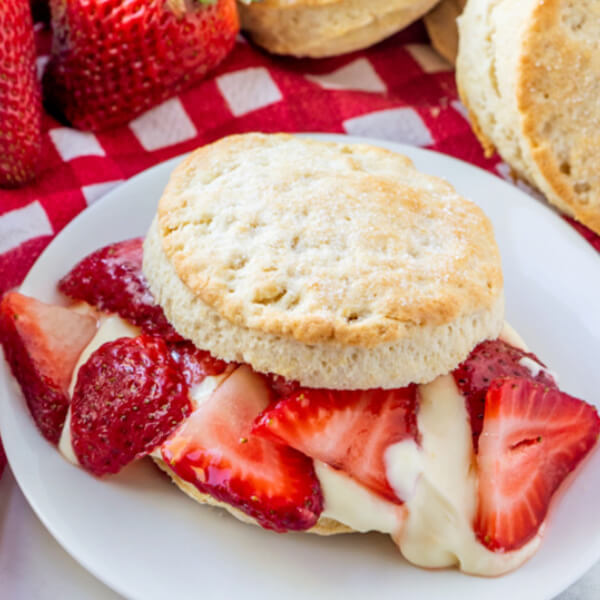 strawberry shortcake with lemon cream sauce on plate