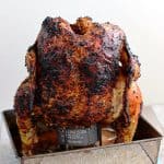 baja citrus chicken on beer can stand in metal tray