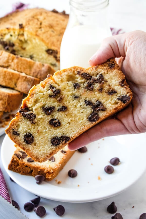 hand holding slice of chocolate chip pound cake