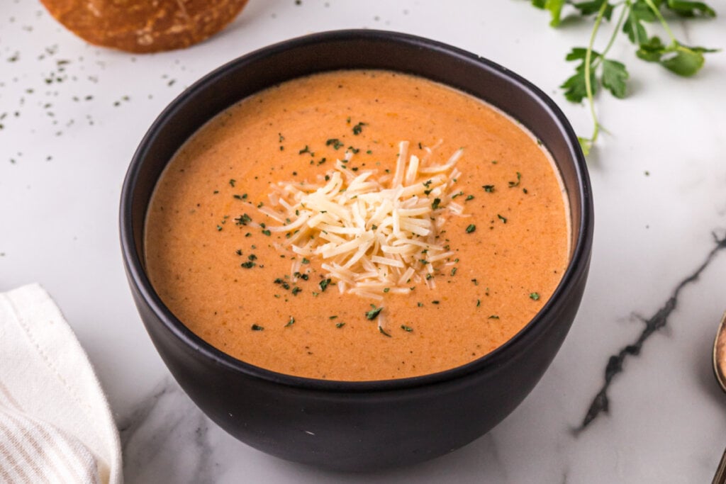 slow cooker tomato soup in black bowl